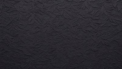 The primary subject of the image is a patterned fabric with a black background. The setting is a wall, and the visual style appears to be a combination of a photo and digital art. The colors and mood of the image are predominantly black, giving it a bold and striking appearance.