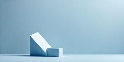 The primary subject of the image is a white box, which is the main object in the scene. The setting is a blue wall, providing a contrasting background. The visual style of the image is a photo, capturing the box and its surroundings. The colors in the image are predominantly blue, creating a calm and serene atmosphere.