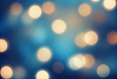 The primary subject of the image is a blue background with a pattern of bright, white lights. The setting appears to be a nighttime scene, possibly a cityscape or a festive event. The visual style of the image is a combination of a photo and digital art, creating a unique and eye-catching effect. The colors and mood of the image are predominantly blue and white, with the bright lights adding a sense of energy and excitement to the scene.