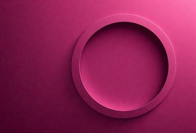 The primary subject of the image is a large, pink circle. The setting is a pink wall, which serves as the background. The visual style is a close-up of the pink circle, showcasing its vibrant color. The dominant colors in the image are pink, and the overall atmosphere is bright and cheerful.