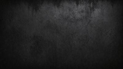 The primary subject of the image is a black leather surface. The setting is a dark room, and the visual style is a close-up of the leather surface. The colors and mood of the image are predominantly dark and moody, with the black leather serving as the main focal point.