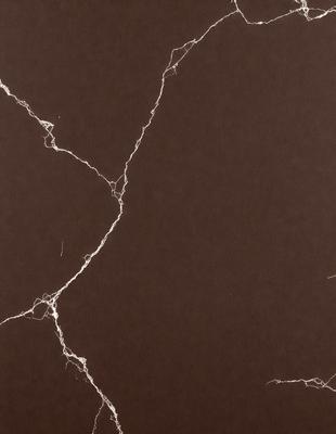 The primary subject of the image is a brown wall with a pattern of thin, white lines. The setting is a room with a brown surface, and the visual style appears to be a photo. The dominant colors are brown and white, creating a warm and earthy atmosphere.
