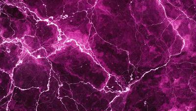 The primary subject of the image is a purple marbled wall with a pinkish hue. The setting is a room with a purple and pink color scheme. The visual style is a close-up of the marbled wall, showcasing its unique texture and design. The colors and mood of the image are vibrant and lively, creating a visually appealing and inviting atmosphere.