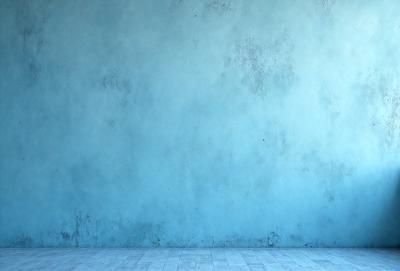 The primary subject of the image is a blue wall with a rough texture. The setting is a room with a wooden floor. The visual style is a photo, and the dominant colors are blue and white. The overall atmosphere is calm and serene.