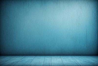 The primary subject of the image is a blue wall with a wooden floor. The setting is a room with a blue wall and a wooden floor. The visual style is a photo, and the dominant colors are blue and wooden tones. The overall atmosphere is calm and serene.