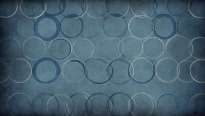The primary subject of the image is a blue background with a pattern of white circles. The setting is a wall, and the visual style appears to be a digital art or illustration. The dominant colors are blue and white, creating a calm and soothing atmosphere.