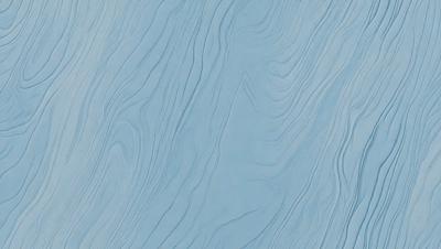 The primary subject of the image is a blue surface with a pattern of waves. The setting is a blue background, and the visual style appears to be a photo. The dominant colors are blue and white, creating a calm and serene atmosphere.