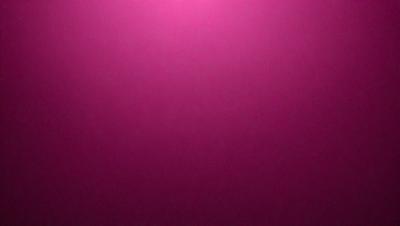 The primary subject of the image is a pink wall. The setting is a room with a pink wall, and the visual style is a close-up of the wall. The dominant colors in the image are pink, and the overall atmosphere is warm and inviting.
