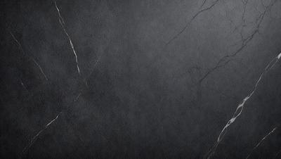 The primary subject of the image is a black and white photo of a wall. The setting is a dark room with a black and white background. The visual style is a black and white photo, which gives the image a classic and timeless appearance. The colors and mood are predominantly dark and moody, with the black and white tones adding a sense of depth and contrast to the scene.