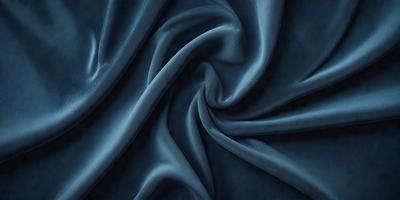 The primary subject of the image is a blue fabric, which is the main object, scene, or focus of the image. The setting or background is a blue cloth, and the visual style is a photo. The dominant colors and overall atmosphere are blue and dark, creating a sense of depth and mystery.