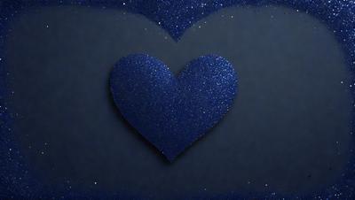 The primary subject of the image is a blue heart-shaped decoration. The setting is a dark background, which contrasts with the blue heart. The visual style is a digital art or illustration, creating a unique and eye-catching design. The colors and mood of the image are predominantly blue, giving it a calm and serene atmosphere.