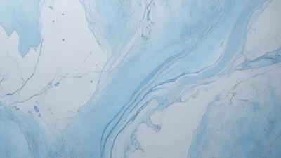The primary subject of the image is a blue and white marbled wall. The setting is a bathroom, with the marbled wall as the main focus. The visual style is a photo, capturing the intricate patterns and textures of the marbled wall. The colors and mood of the image are predominantly blue and white, creating a calm and serene atmosphere.