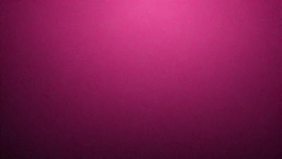 The primary subject of the image is a pink wall. The setting is a room with a pink background. The visual style is a close-up of the pink wall, which gives a sense of depth and texture. The dominant colors are pink, and the overall atmosphere is warm and inviting.