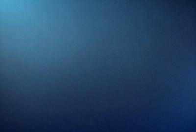 The primary subject of the image is a blue sky with no clouds. The setting is a vast, open space with no visible landmarks or objects. The visual style is a simple, clean, and minimalistic representation of the sky. The colors and mood are predominantly blue, creating a calm and serene atmosphere.