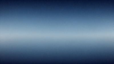 The primary subject of the image is a vast, dark blue sky. The setting is a clear, cloudless night, with no visible land or objects. The visual style is a natural, untouched photograph. The colors and mood convey a sense of tranquility and vastness.