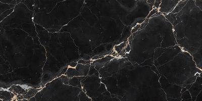 The primary subject of the image is a marble countertop with a black and gold pattern. The setting is a kitchen, and the visual style is a close-up of the countertop. The colors and mood of the image are predominantly black and gold, giving it a luxurious and elegant appearance.