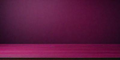 The primary subject of the image is a wooden table with a purple surface. The table is placed against a purple wall, creating a striking contrast between the two colors. The visual style of the image is a photo, capturing the details of the wooden table and the purple wall. The colors and mood of the image are predominantly purple, giving it a calm and serene atmosphere.