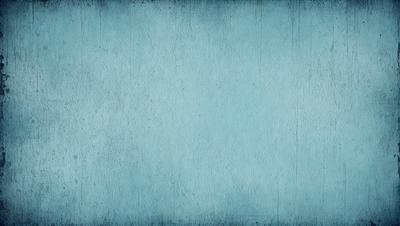 The primary subject of the image is a blue wall with a textured surface. The setting is a room with a blue wall, and the visual style is a photo. The dominant colors are blue and white, creating a calm and serene atmosphere.