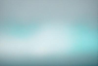 The primary subject of the image is a cloudy sky. The setting is a vast, open space with a blue hue. The visual style is a photo, capturing the beauty of the cloudy sky. The colors and mood convey a sense of tranquility and serenity.