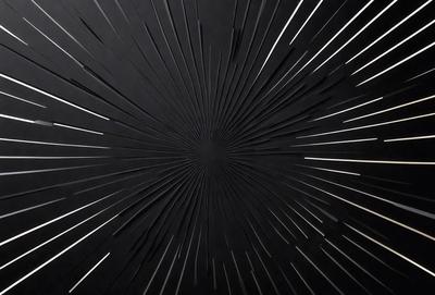 The primary subject of the image is a black and white photo of a star field. The setting is a black background, and the visual style is a close-up of the star field. The image has a mood of mystery and depth, as the stars are the main focus of the photo.