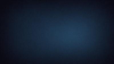 The primary subject of the image is a dark blue sky. The setting is a vast, open space with no visible landmarks or objects. The visual style is a simple, monochromatic image with no additional elements or textures. The colors and mood of the image are predominantly dark and moody, creating a sense of vastness and emptiness.