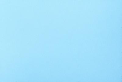 The primary subject of the image is a clear blue sky. The setting is a vast, open space with no visible landmarks or objects. The visual style is a natural, outdoor scene. The colors and mood are predominantly blue, creating a calm and serene atmosphere.