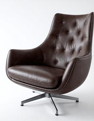 The primary subject of the image is a brown leather chair with a cushion on it. The chair is placed on a white surface, which serves as the background. The visual style of the image is a photo, capturing the details of the chair and its cushion. The colors in the image are predominantly brown and white, creating a warm and neutral atmosphere.