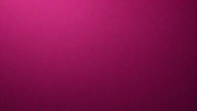 The primary subject of the image is a large, pink wall. The setting is a room with a pink background, and the visual style is a close-up of the wall. The dominant colors in the image are pink, and the overall atmosphere is warm and inviting.