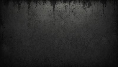 The primary subject of the image is a black and white photo of a wall. The setting is a concrete wall, and the visual style is a black and white photo. The colors and mood of the image are predominantly dark and moody, with the black and white color scheme adding to the atmosphere.