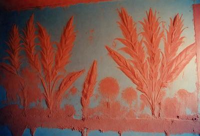 The primary subject of the image is a wall with a design featuring three plants. The setting is a wall with a blue background, and the visual style is a combination of a photo and digital art. The colors and mood of the image are predominantly red and orange, creating a warm and vibrant atmosphere.