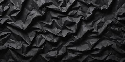 The primary subject of the image is a black and white patterned paper, which is the main object, scene, or focus of the image. The setting or background is a black surface, and the visual style is a patterned paper. The colors and mood of the image are predominantly black and white, giving it a classic and timeless appearance.