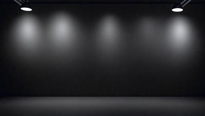 The primary subject of the image is a black and white photo of a stage with three lights. The setting is a dark room, and the visual style is a black and white photo. The dominant colors are black and white, and the overall atmosphere is dramatic and moody.