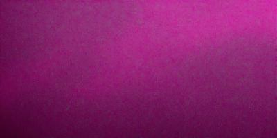 The primary subject of the image is a large, pink wall. The setting is a room with a pink background, and the visual style is a close-up of the wall. The dominant colors in the image are pink, and the overall atmosphere is bright and vibrant.