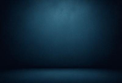 The primary subject of the image is a blue wall. The setting is a dark room with a blue background. The visual style is a photo, and the colors and mood are predominantly blue, creating a calm and serene atmosphere.
