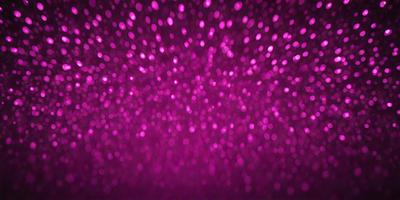 The primary subject of the image is a pink background with a purple hue. The setting is a dark background, which contrasts with the pink and purple colors. The visual style is a close-up of the pink and purple background, showcasing the vibrant colors and textures. The colors and mood of the image are predominantly pink and purple, creating a warm and inviting atmosphere.