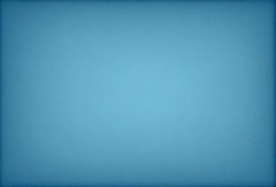 The primary subject of the image is a large, empty, and dark blue sky. The setting is a vast, open space with no visible landmarks or objects. The visual style is a natural, untouched, and unaltered representation of the sky. The colors and mood convey a sense of tranquility and vastness.