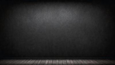 The primary subject of the image is a large, empty room with a black wall. The setting is a dark room, and the visual style is a black and white photo. The colors and mood of the image are predominantly dark and moody, with the black wall and the lack of any other objects or decorations contributing to the overall atmosphere.