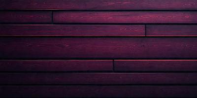 The primary subject of the image is a wooden wall with a purple tint. The setting is a room with a wooden wall, and the visual style is a close-up of the wooden wall. The colors and mood of the image are predominantly purple, creating a calm and serene atmosphere.