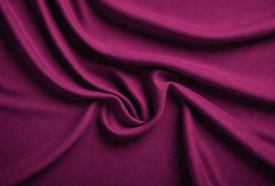 The primary subject of the image is a purple fabric, which is the main object, scene, or focus of the image. The setting or background is a purple cloth, and the visual style is a photo. The dominant colors and overall atmosphere are purple, creating a calm and soothing mood.
