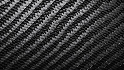 The primary subject of the image is a pattern of black and white shapes, which are arranged in a visually appealing manner. The setting is a black background, which contrasts with the shapes and adds depth to the image. The visual style is a combination of digital art and illustration, creating a unique and intriguing design. The colors and mood of the image are predominantly black and white, giving it a classic and timeless feel.