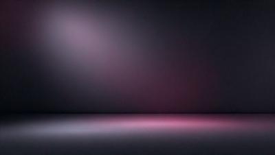 The primary subject of the image is a large, brightly lit pink wall. The setting is a dark room, and the visual style appears to be a photo. The dominant colors in the image are pink and purple, creating a warm and inviting atmosphere.