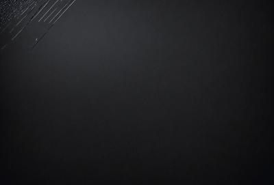The primary subject of the image is a black background with a white wire. The setting is a dark room, and the visual style is a close-up of the wire. The colors are predominantly black and white, creating a stark and minimalist atmosphere.