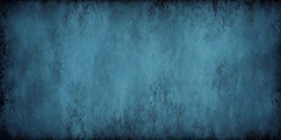 The primary subject of the image is a blue wall with a textured surface. The setting is a room with a blue wall, and the visual style is a close-up of the wall. The dominant colors are blue and grey, creating a calm and soothing atmosphere.
