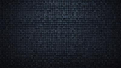 The primary subject of the image is a black and white brick wall. The setting is a dark room, and the visual style is a close-up of the brick wall. The colors and mood of the image are predominantly dark and moody, with the black and white color scheme adding to the atmosphere.