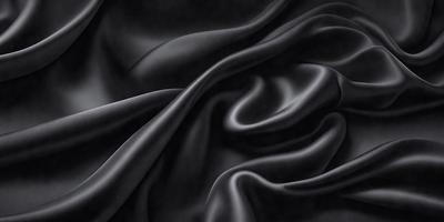 The primary subject of the image is a black fabric, which is the main object, scene, or focus of the image. The setting/background consists of a black background, which provides a contrasting and dramatic effect. The visual style of the image is a black and white photo, which adds a timeless and classic feel to the composition. The colors and mood of the image are predominantly black, creating a sense of mystery and sophistication.