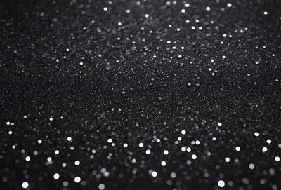 The primary subject of the image is a black background with a pattern of white lights or stars. The setting appears to be a night sky, and the visual style is a close-up of the pattern. The colors are predominantly black and white, creating a contrasting and visually striking scene.