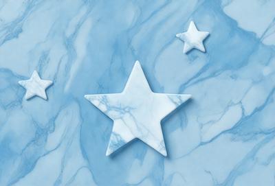 The primary subject of the image is a white star, which is the main object, scene, or focus of the image. The setting is a blue marble surface, which serves as the backdrop for the star. The visual style of the image is a photo, capturing the star in its natural environment. The colors and mood of the image are predominantly blue, creating a calm and serene atmosphere.