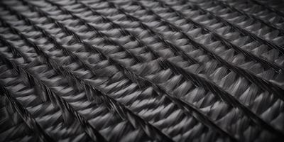 The primary subject of the image is a black and white patterned fabric. The setting is a black background, and the visual style appears to be a photo. The colors and mood of the image are predominantly black and white, creating a classic and timeless atmosphere.