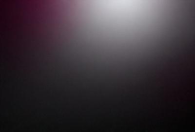 The primary subject of the image is a dark, foggy sky. The setting is a black background, which creates a dramatic and moody atmosphere. The visual style is a photo, capturing the foggy sky in its natural state. The colors and mood of the image are predominantly dark and mysterious, with the foggy sky serving as the main focal point.