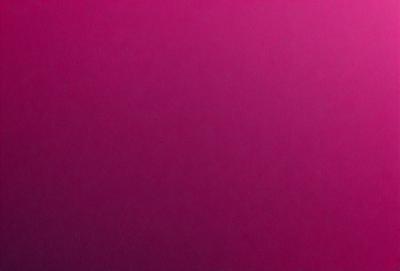 The primary subject of the image is a large, pink wall. The setting is a room with a pink background, and the visual style is a close-up of the wall. The dominant colors in the image are pink, and the overall atmosphere is warm and inviting.